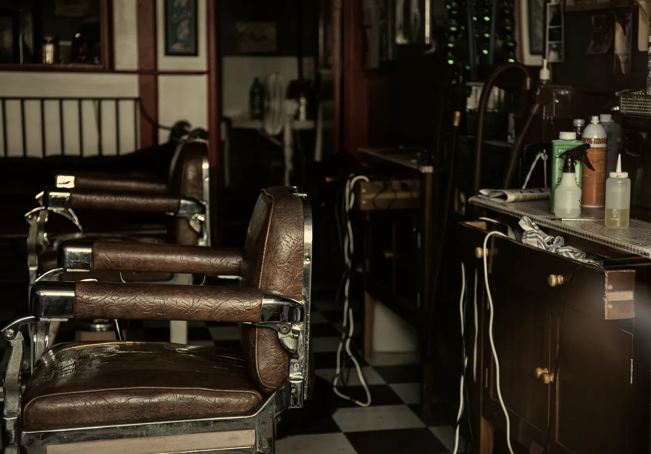 Vintage leather barber chairs and stations inside the shop